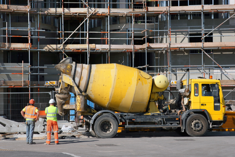 Transit mixers and RMC pumps reducing labor costs at a construction site