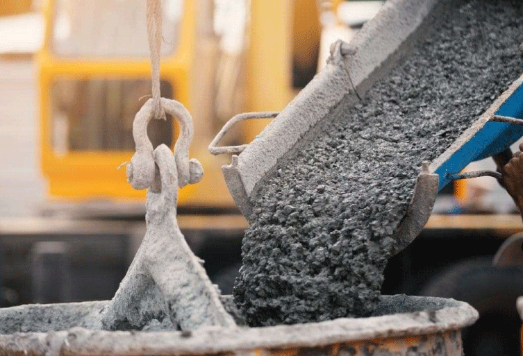 Ready Mix Concrete pouring from transit mixer at construction site