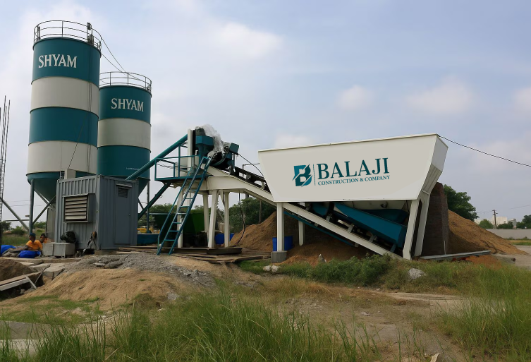 Balaji Construction and Company RMC plant in Ajmer featuring Shyam cement silos and aggregate batching unit.