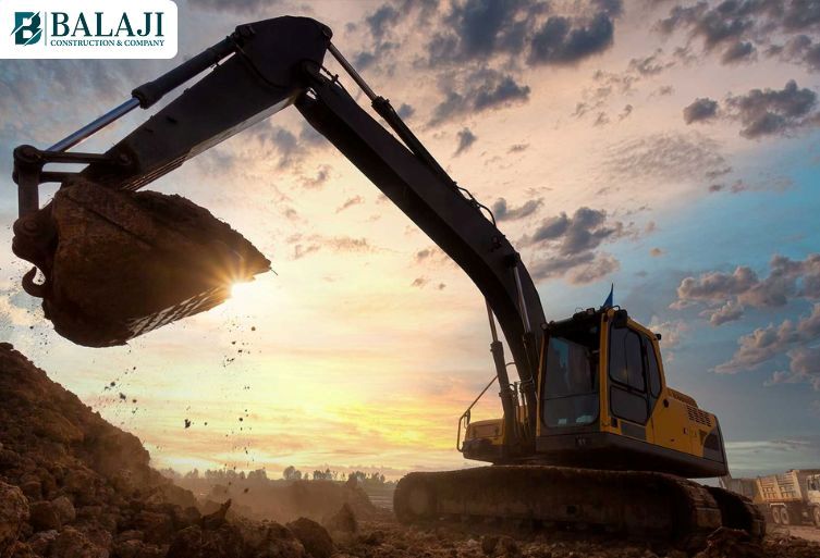Construction machinery equipment including concrete mixers, excavators, and cranes at Ajmer construction site