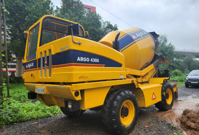 AJAX Argo 4300 self-loading concrete mixer from Pushkar Fiori Rental on a construction site.