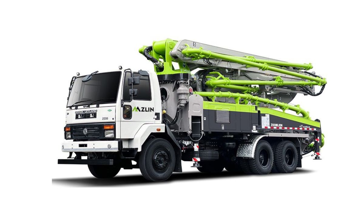 A 20-30 meter small concrete boom pump by Balaji Construction & Co. operating in a narrow residential street in Ajmer.